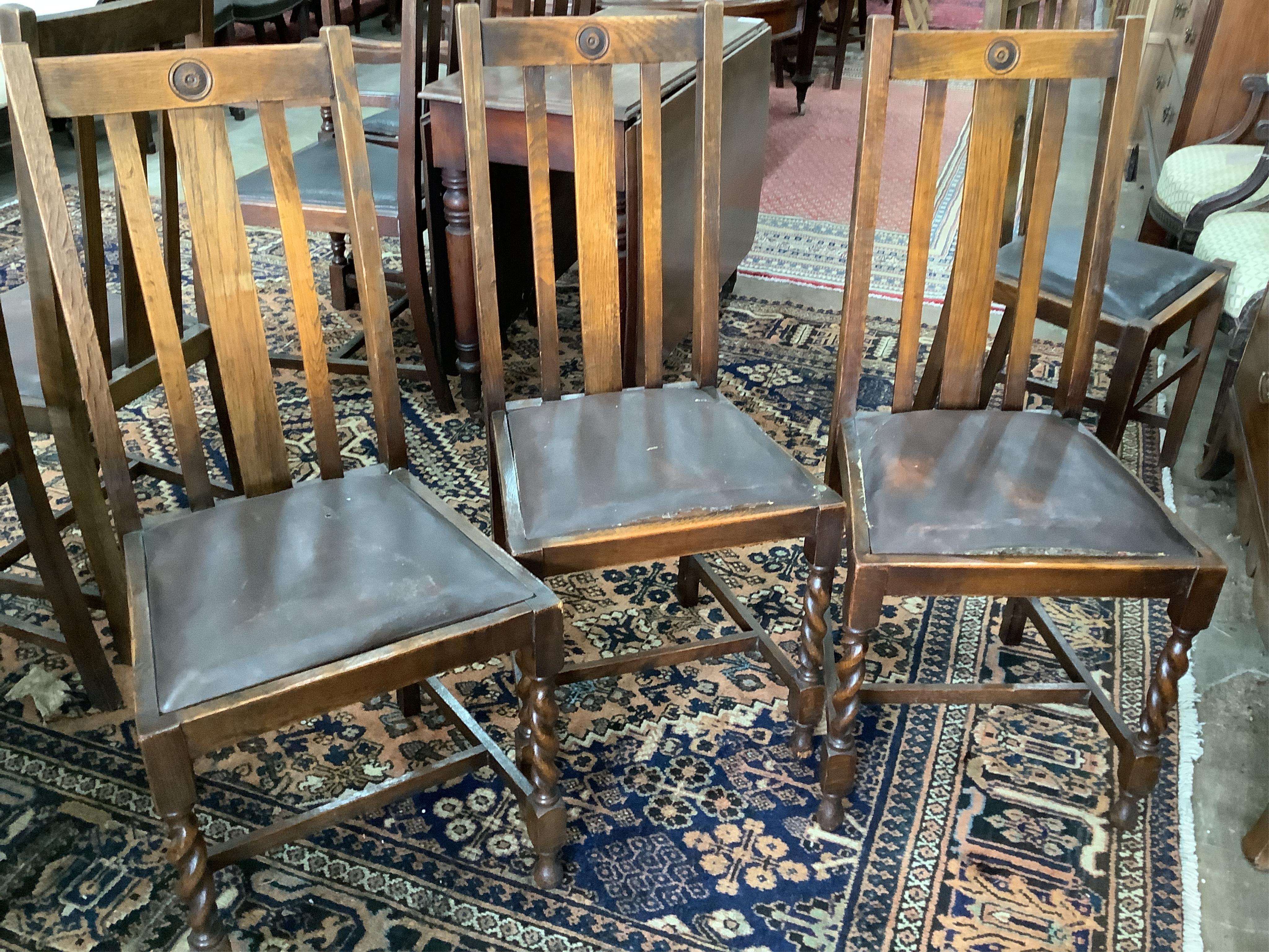 Eight 1920's oak dining chairs, two with arms